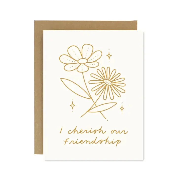The I Cherish Our Friendship Card by Worthwhile Paper features two gold line-drawn flowers and "I cherish our friendship" on the front, paired with a recycled brown envelope.