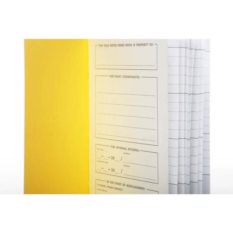 An open Ignition | Field Notes memo book by Field Notes shows a printed checklist journal on the inside yellow cover and lined pages for notes or plans on the right.