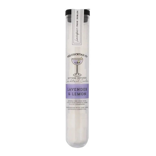 A clear tube with a black cap labeled “Lavender & Lemon Champagne Cocktail Cubes” by Yes Cocktail Co., featuring a cocktail glass graphic and containing organic cane sugar cubes.