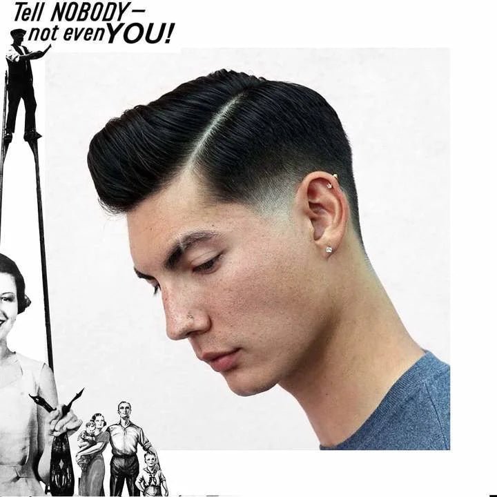 A man with a classic side-part and faded undercut looks down. Text reads, "Tell NOBODY—not even YOU!" Vintage art frames his natural finish, styled with Uppercut Deluxe Matte Pomade for medium hold and a matte look.