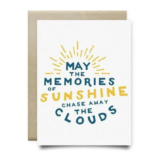 The "Memories of Sunshine Sympathy Card" by Anvil Cards is an A2 linen card with "May the memories of sunshine chase away the clouds" in blue and yellow and a sunburst design. Blank inside for your message.