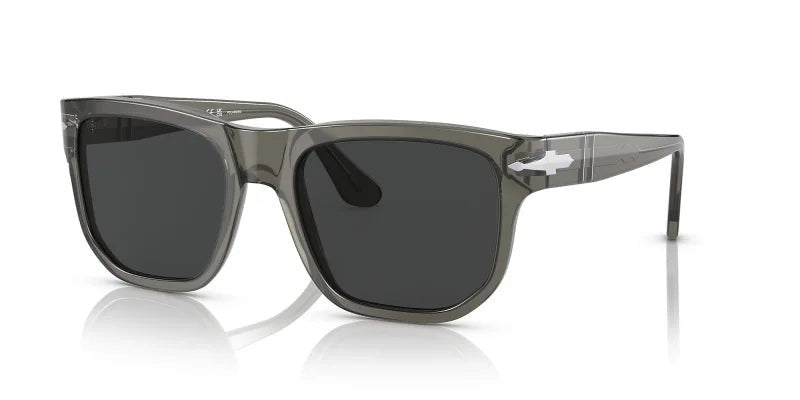 The Persol Opal Smoke w/ Dark Grey Polar 0PO3306S sunglasses feature gray transparent frames, dark rectangular lenses, medium temples, and a small white logo on the arm, shown on a white background.