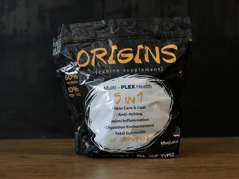 A black bag of Origins Canine Supplement by Rogue Pet Feed offers 5-in-1 benefits—skin care, anti-itching, joint support, digestion & gut health—with omega 3 fish protein. Contains 90 servings.