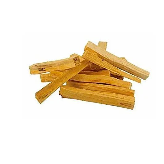 A pile of yellowish-brown Palo Santo | Austen & Parker wooden sticks from Taos Herb Co arranged on a white background.