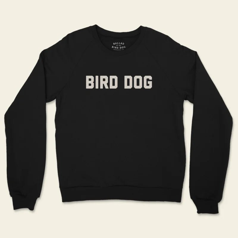 The Bird Dog Sweater by Ballad of the Bird Dog is a unisex crewneck made in the USA, featuring "BIRD DOG" in bold, light letters across the front.