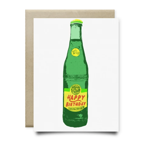 The Topo Happy Birthday Card by Anvil Cards features a green glass bottle with a yellow "Happy Birthday" label, printed on linen paper. Comes with a brown envelope and is blank inside for your message.