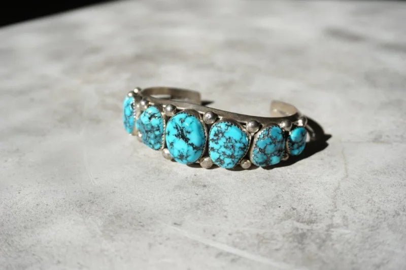 Sterling silver turquoise cuff bracelet with vibrant turquoise stones for a vintage look