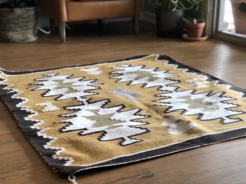 Geometric patterned Two Grey Hills vintage rug showcasing grey hills design