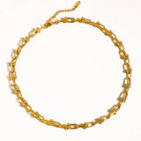 Denise Bold Chain Necklace by Flanerie by MAIQ, a gold-tone 18K gold chain with U-shaped links and a small adjustable extender, designed as a hypoallergenic necklace.