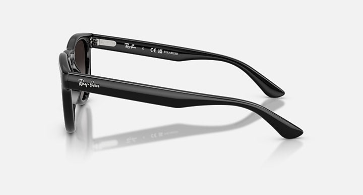 Polished black Ray-Ban RB2237 sunglasses with a phantos frame shown from a side profile.