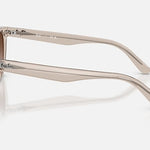 Side view of translucent beige Ray-Ban RB2243D sunglasses with brown gradient lenses.