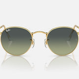 Ray-Ban 3447 Round Metal sunglasses with round gold frames and gradient green vintage lenses, shown against a white background.