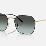 Ray-Ban 3694 Jim sunglasses feature an irregular metal frame with gold accents, black rims, and blue gradient lenses, displayed on a white background.