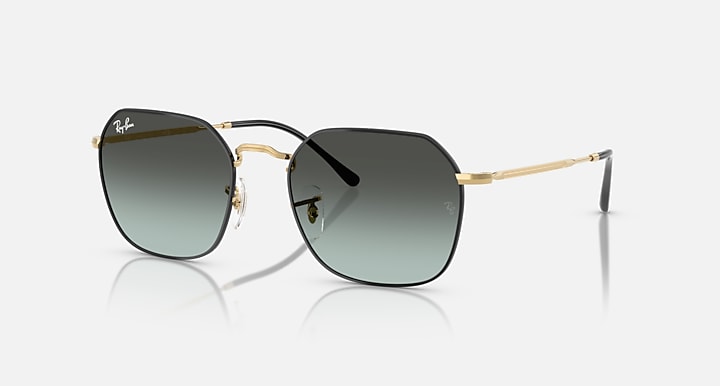 Ray-Ban 3694 Jim sunglasses feature an irregular metal frame with gold accents, black rims, and blue gradient lenses, displayed on a white background.