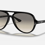 The Ray-Ban RB4125 aviator-style sunglasses showcase a polished black frame with dark light grey gradient lenses, accented by white Ray-Ban logos on both the lenses and arms, all displayed against a plain light background.