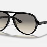 The Ray-Ban RB4125 aviator-style sunglasses showcase a polished black frame with dark light grey gradient lenses, accented by white Ray-Ban logos on both the lenses and arms, all displayed against a plain light background.