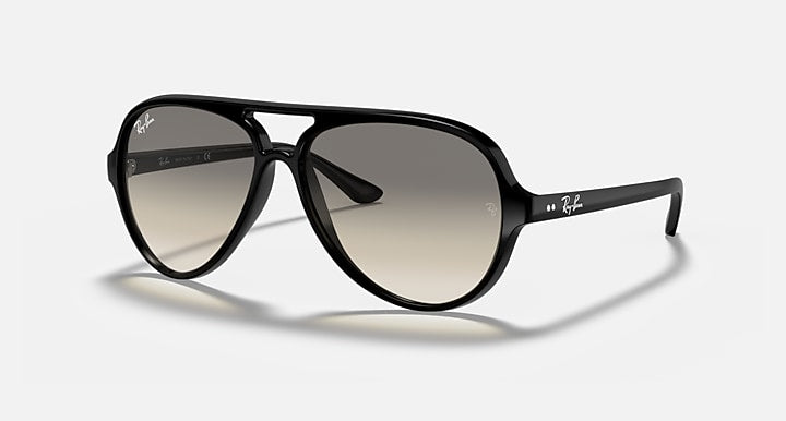 The Ray-Ban RB4125 aviator-style sunglasses showcase a polished black frame with dark light grey gradient lenses, accented by white Ray-Ban logos on both the lenses and arms, all displayed against a plain light background.
