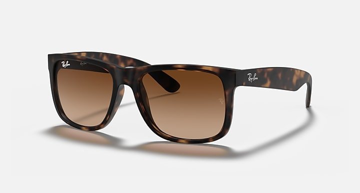 Ray-Ban 4165 Justin sunglasses with a dark tortoiseshell frame and brown gradient polarized lenses, shown angled on a plain white background.