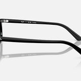 Zaya RB4456F sunglasses by Ray-Ban shown in a side profile on a white background, highlighting the Ray-Ban logo on both the temple and temple tip. These sunglasses feature a sleek black injected frame paired with polarized dark grey lenses, offering a modern and sophisticated aesthetic.