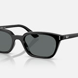 The Ray-Ban Zaya RB4456F sunglasses feature a sleek black injected rectangular frame with polarized dark grey lenses, displayed on a white background. The Ray-Ban logo is visible on the right lens and temple.