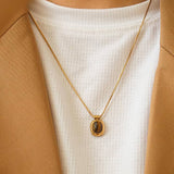 Dax Natural Stone Necklace by Flanerie by MAIQ, an 18K gold chain necklace featuring a smooth, oval-shaped green aventurine pendant.