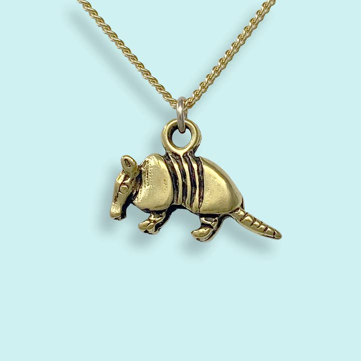 Armadillo Necklace by Ornamental Things featuring a gold-plated curb chain with an armadillo pendant.