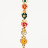 Elysian Baroque Heart Color Bracelet by Flanerie by MAIQ, a matte 18K gold-plated bracelet featuring a series of colorful enameled Baroque heart charms.