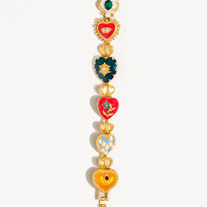 Elysian Baroque Heart Color Bracelet by Flanerie by MAIQ, a matte 18K gold-plated bracelet featuring a series of colorful enameled Baroque heart charms.