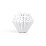 A stack of Kalita 155 Paper Filters, white and fluted, is arranged neatly against a plain white background.