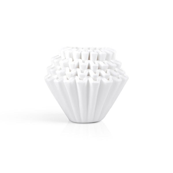A stack of Kalita 155 Paper Filters, white and fluted, is arranged neatly against a plain white background.
