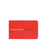 The Field Notes 1943 Two-way Memo Book features a red cover with yellow text, rounded corners, visible spine, and classic design details inspired by 1943 memo books.