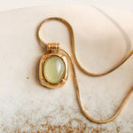 Dax Natural Stone Necklace featuring an 18K gold-tone chain and an oval green aventurine pendant.
