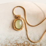 Dax Natural Stone Necklace featuring an 18K gold-tone chain and an oval green aventurine pendant.