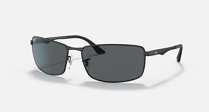 Ray-Ban 3498 sunglasses feature a rectangular black metal frame, thin arms, and brushed aluminum temples with dark lenses, shown on a plain white background.