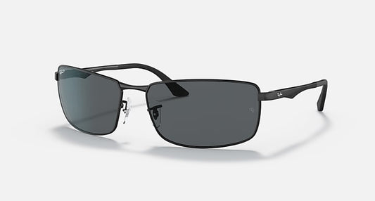 Sleek rectangular black Ray-Ban 3498 sunglasses with dark lenses and slim brushed aluminum arms, featuring subtle Ray-Ban logos on the right lens and both temples for a sporty style.