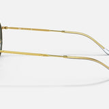 Side view of Ray-Ban 3565 sunglasses by Ray-Ban, featuring gold metal frames, dark lenses, and clear ear tips, shown on a plain light background.