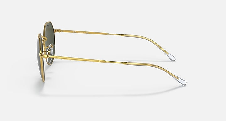 Side view of Ray-Ban 3565 sunglasses by Ray-Ban, featuring gold metal frames, dark lenses, and clear ear tips, shown on a plain light background.