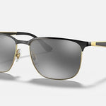 Ray-Ban 3569 square metal sunglasses with black and gold frames and gray tinted lenses, shown on a plain light background.