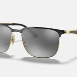 Ray-Ban 3569 sunglasses by Ray-Ban feature a rectangular black and gold square metal frame, double bridge, dark tinted lenses, and adjustable nose pads, shown on a plain light background.