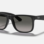Black Ray-Ban 4165 Justin polarized sunglasses with dark lenses, shown on a white background. The Ray-Ban logo appears on the upper corners of both arms and one lens.