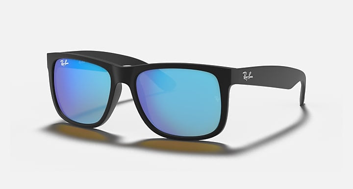 Ray-Ban 4165 Justin sunglasses with black frames and blue mirrored lenses, inspired by the classic Wayfarer, shown on a white background.