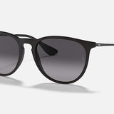 Ray-Ban 4171 Erika sunglasses feature round, gradient gray lenses and black frames, providing stylish UV protection. Pictured on a light background.