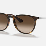 Ray-Ban 4171 Erika sunglasses feature a round tortoiseshell frame, brown gradient lenses, thin metal arms, and stylish UV protection, shown on a white background.