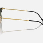 Side view of Ray-Ban 4416 gold metal Clubmaster sunglasses with black temple tips and dark lenses, displayed on a light gray background for a sleek, minimalist eyewear look.
