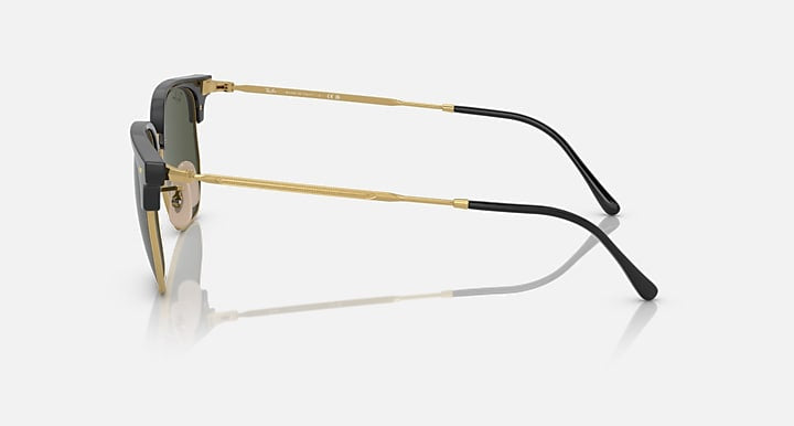 Side view of Ray-Ban 4416 sunglasses featuring gold metal frames, black temple tips, and green rectangular Chromance lenses on a white background—ideal for fans of minimalist eyewear.