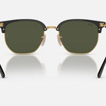 Front view of Ray-Ban 4416 sunglasses by Ray-Ban, showcasing black and gold frames with green Chromance lenses, displayed on a white background for a minimalist eyewear look.