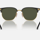 The Ray-Ban 4416 sunglasses feature a square Clubmaster design with black and gold frames, green lenses, and black arms—ideal minimalist eyewear for those seeking iconic Ray-Ban style.