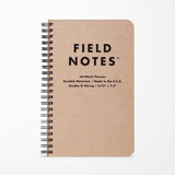 The Field Notes 56-Week Planner is a spiral-bound kraft paper planner with a durable chipboard cover, labeled "56-Week Planner | Field Notes," and includes details about its materials and size on the front.