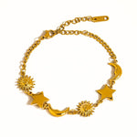 Leonora Sun and Star Bracelet by Flanerie by MAIQ, a hypoallergenic gold chain bracelet with alternating sun, moon, and star charms.
