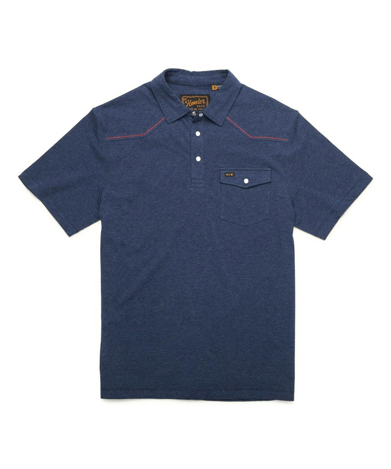 Introducing the Ranchero Polo by Howler Brothers—a blue short-sleeve polo shirt featuring a classic collar and front buttons, plus a chest pocket with button flap. Subtle red stitching details accent the shoulders, while classic Western yokes and refined chainstitch embroidery add a distinctive touch.